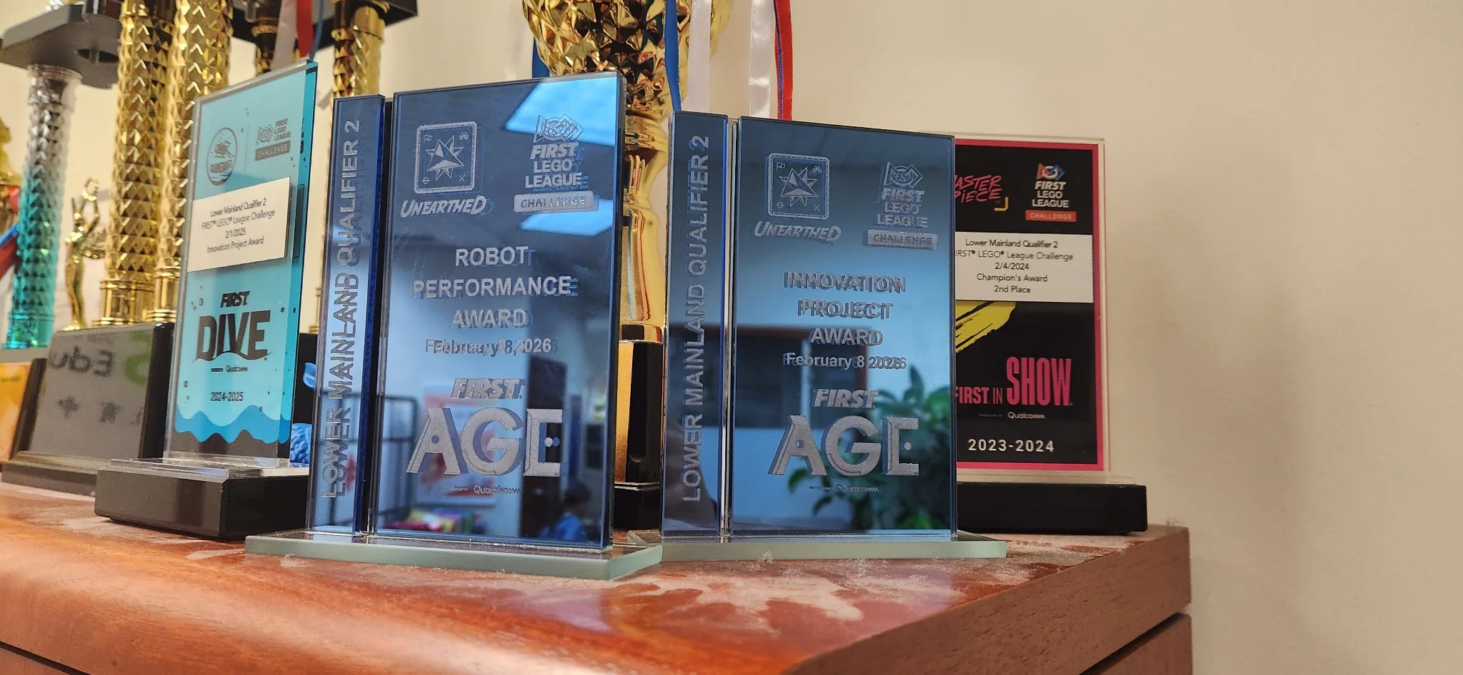 Collection of robotics competition awards earned across three years